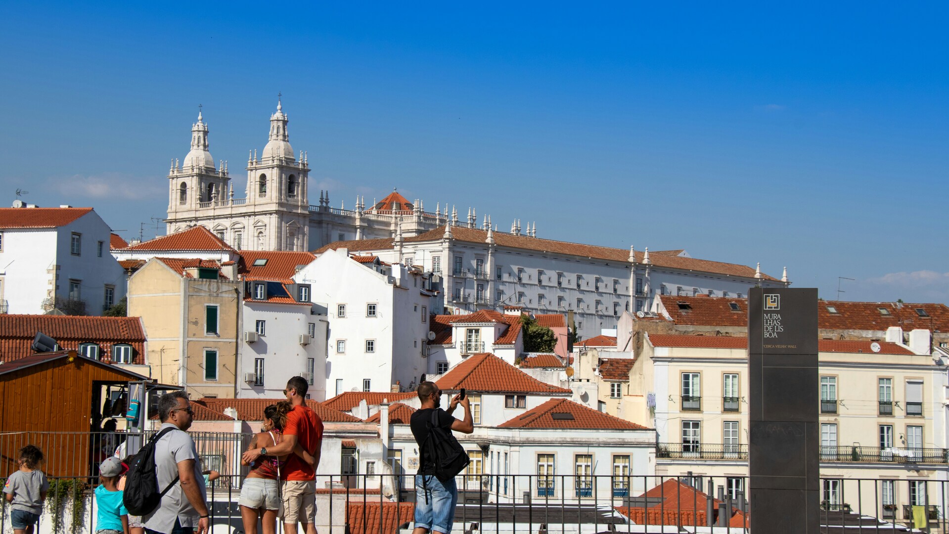 visitors at Portas do Sol viewpoint on a clear spring afternoon