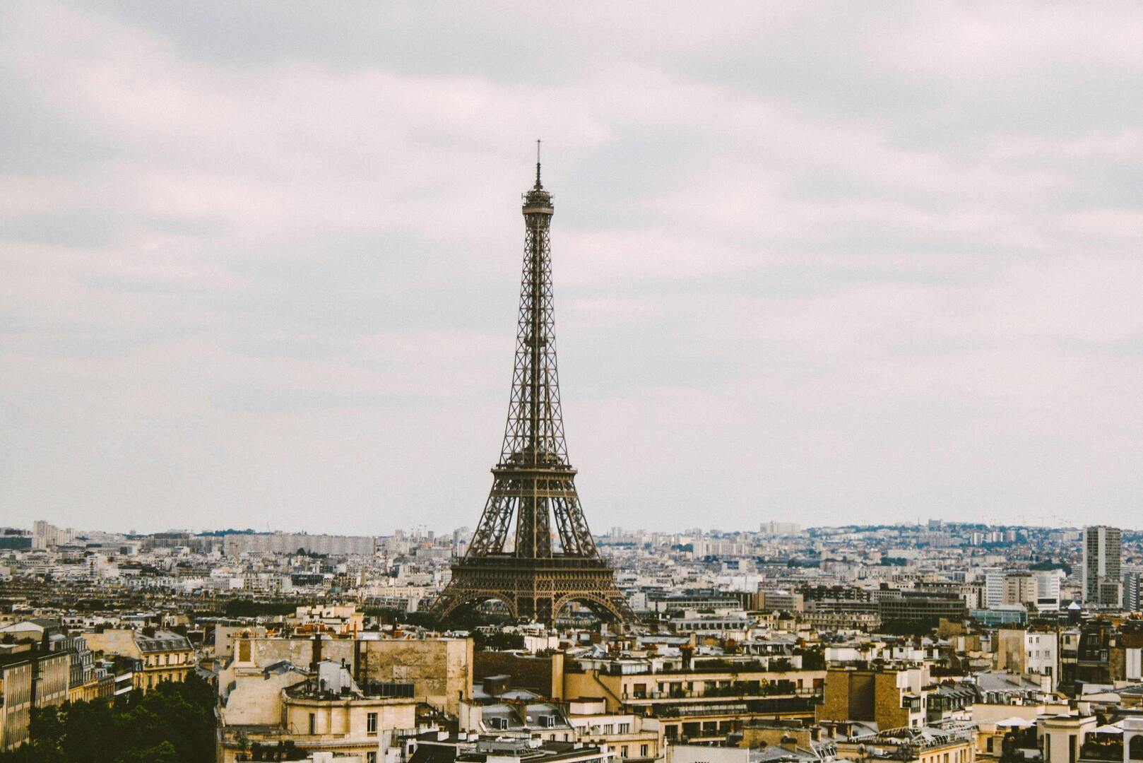 The Eiffel Tower rising above Paris rooftops