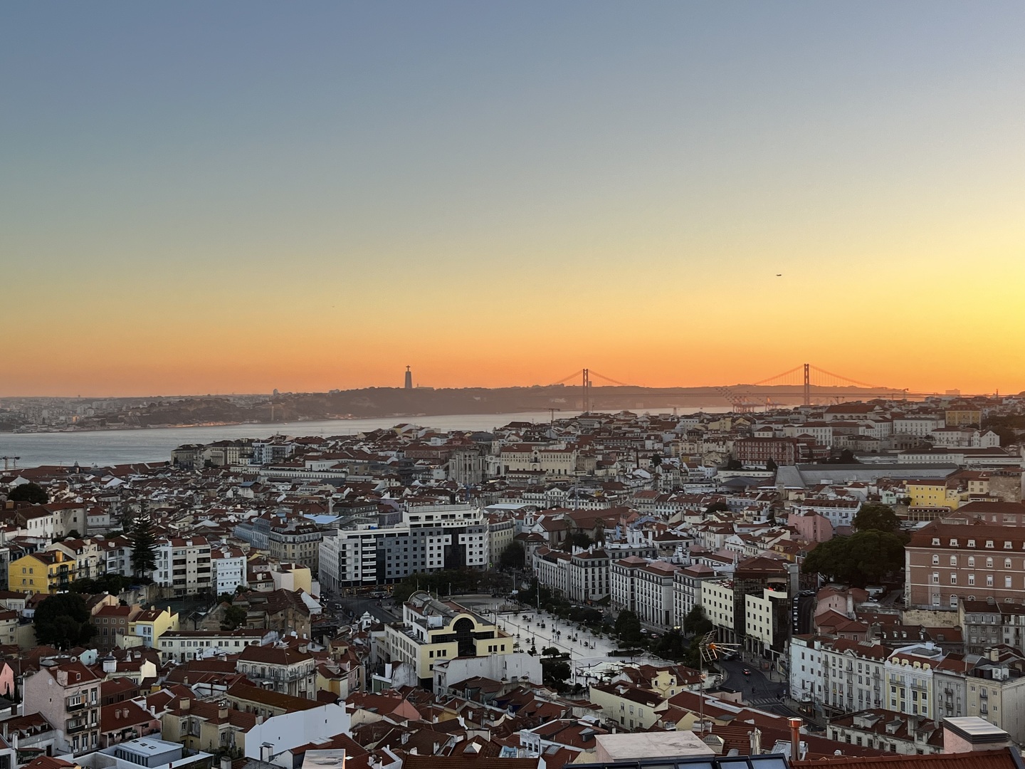Spring view from a Lisbon miradouro over rooftops and the Tagus