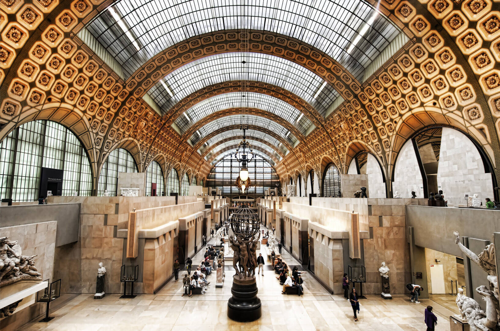 The upper-floor Impressionist galleries of the Musée d'Orsay with Monet and Renoir canvases lining the walls