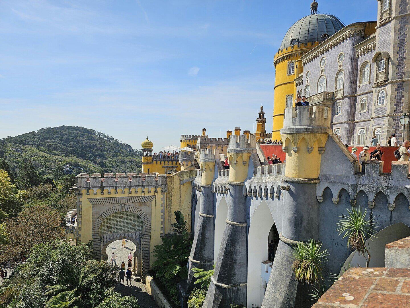 Colorful Pena Palace terraces under shifting spring light