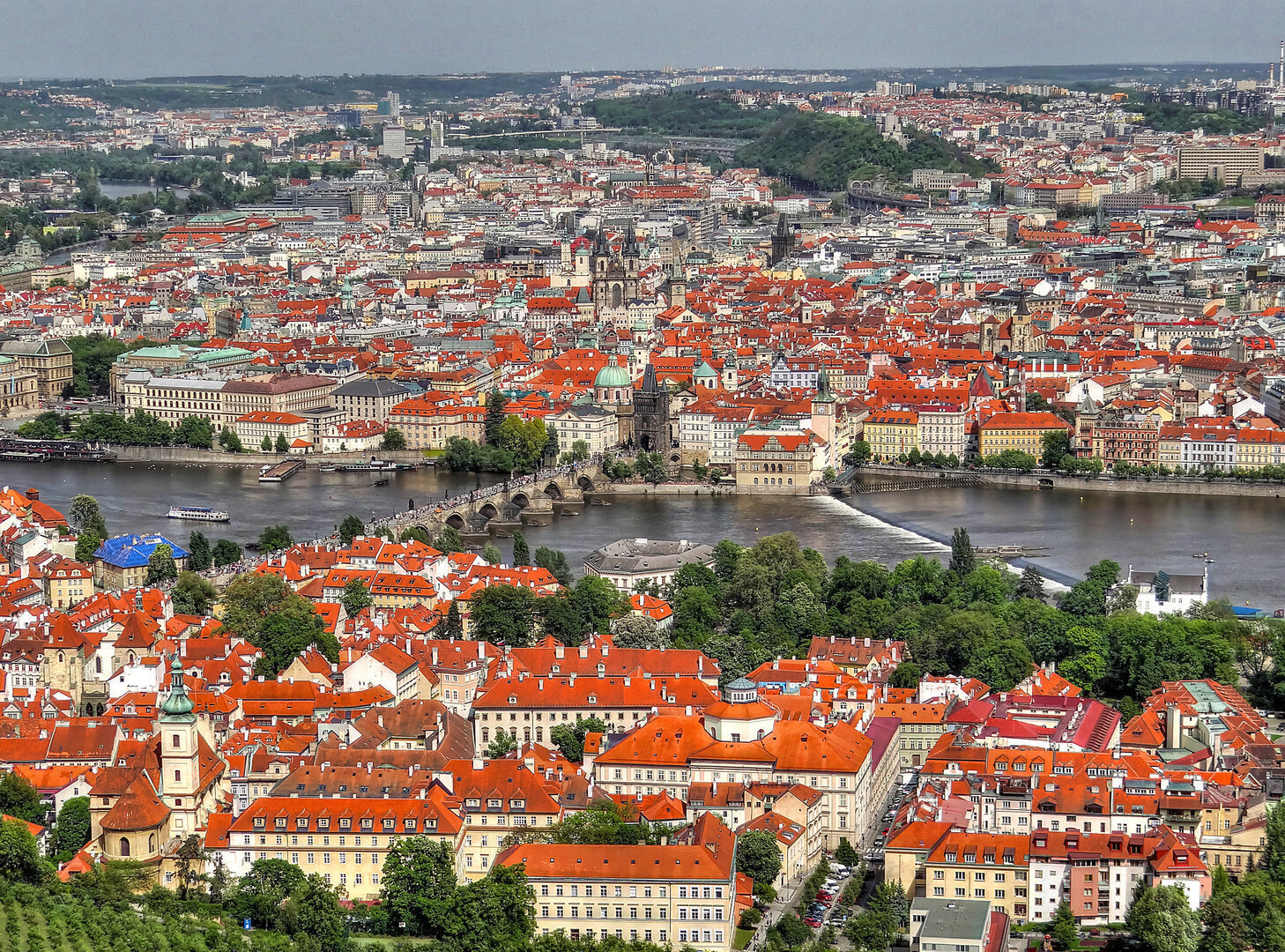 View over Prague from Petřín Hill in May with the city spread below under a clear sky