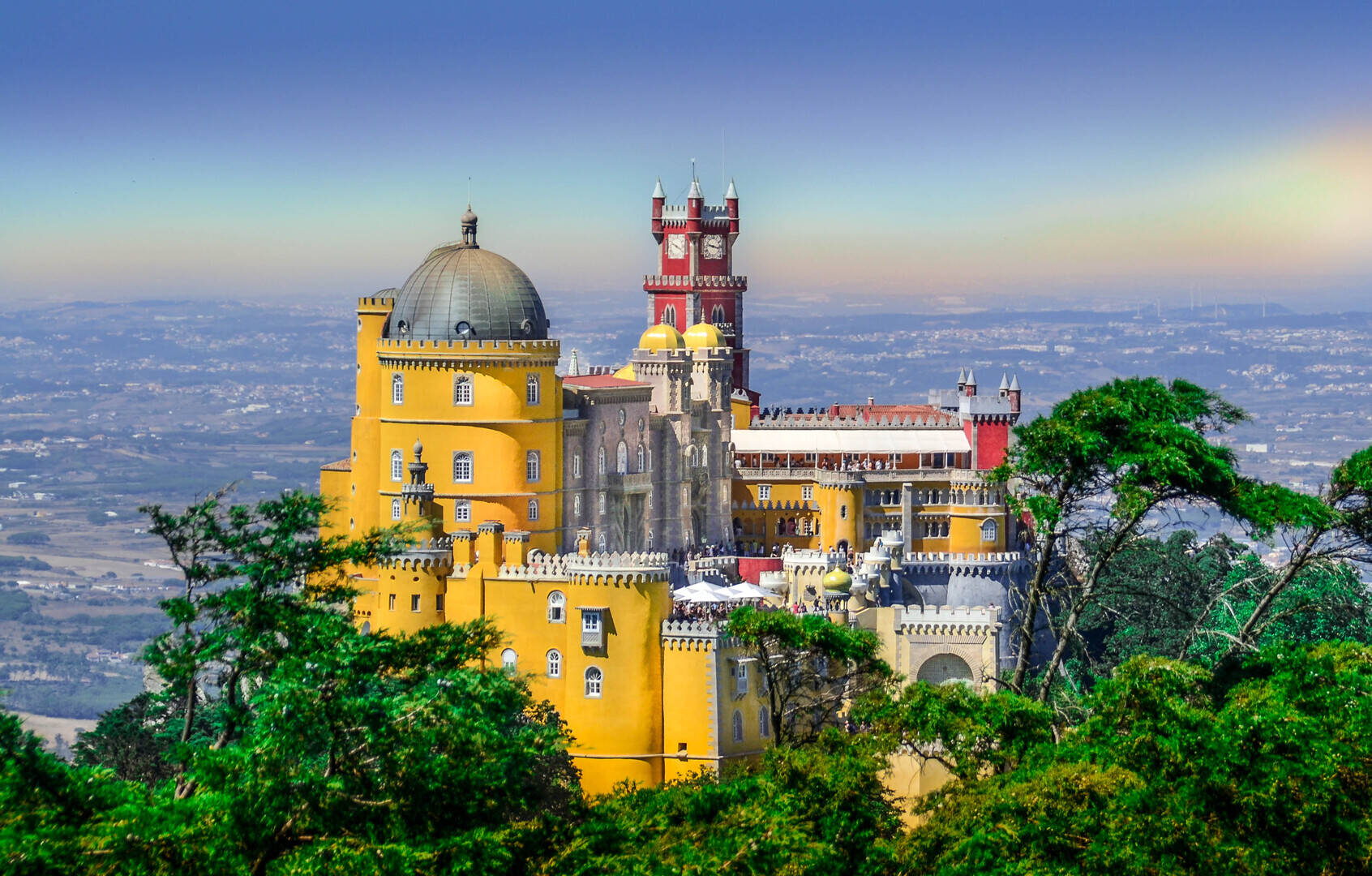 Pena Palace towers rising above spring fog in Sintra