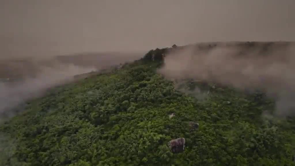 Misty aerial view over the forested hills of Cambodia that once reclaimed Angkor's temples