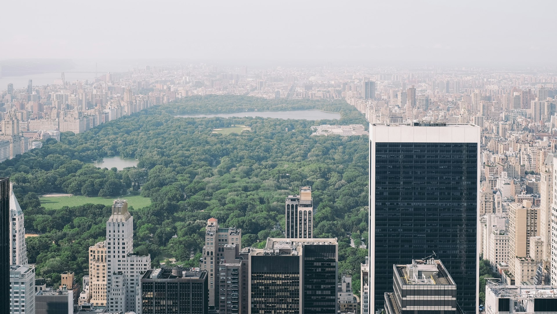 Aerial view of Central Park surrounded by the Manhattan skyline